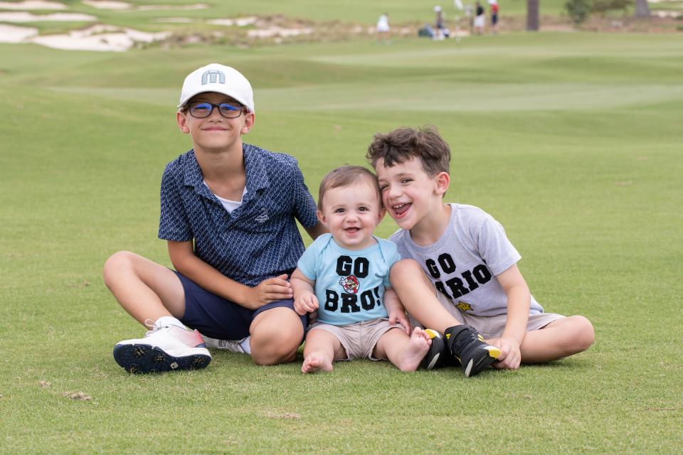 Hopewell Junction's Vilardi brothers pose together on a golf course. From left: Mario, Angelo and Charlie.