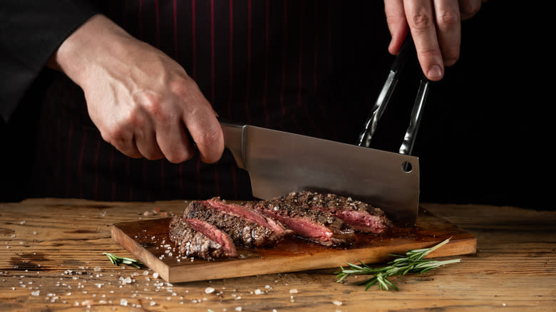 chef slicing beef steak