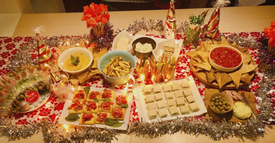 Decorate your table with leftover wrapping paper instead of a table runner and add tinsel. Photo: Supplied