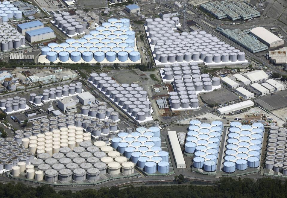 This aerial view shows the tanks which contain treated radioactive wastewater at the Fukushima Daiichi nuclear power plant in Fukushima, northern Japan, on Aug. 22, 2023. For the wrecked Fukushima Daiichi nuclear plant, managing the ever-growing radioactive water held in more than 1,000 tanks has been a safety risk and a burden since the meltdown in March 2011. The start of treated wastewater release Thursday marked a milestone for the decommissioning, which is expected to take decades. (Kyodo News via AP)