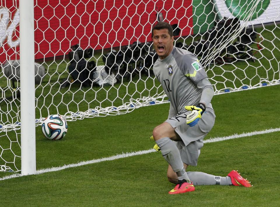 Brazil's goalkeeper Julio Cesar reacts after conceding a goal to Germany's Toni Kroos (unseen) during their 2014 World Cup semi-finals at the Mineirao stadium in Belo Horizonte July 8, 2014. REUTERS/David Gray