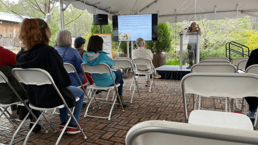 <em>Dr. Jill Anderson presenting to a group of attendees.</em>