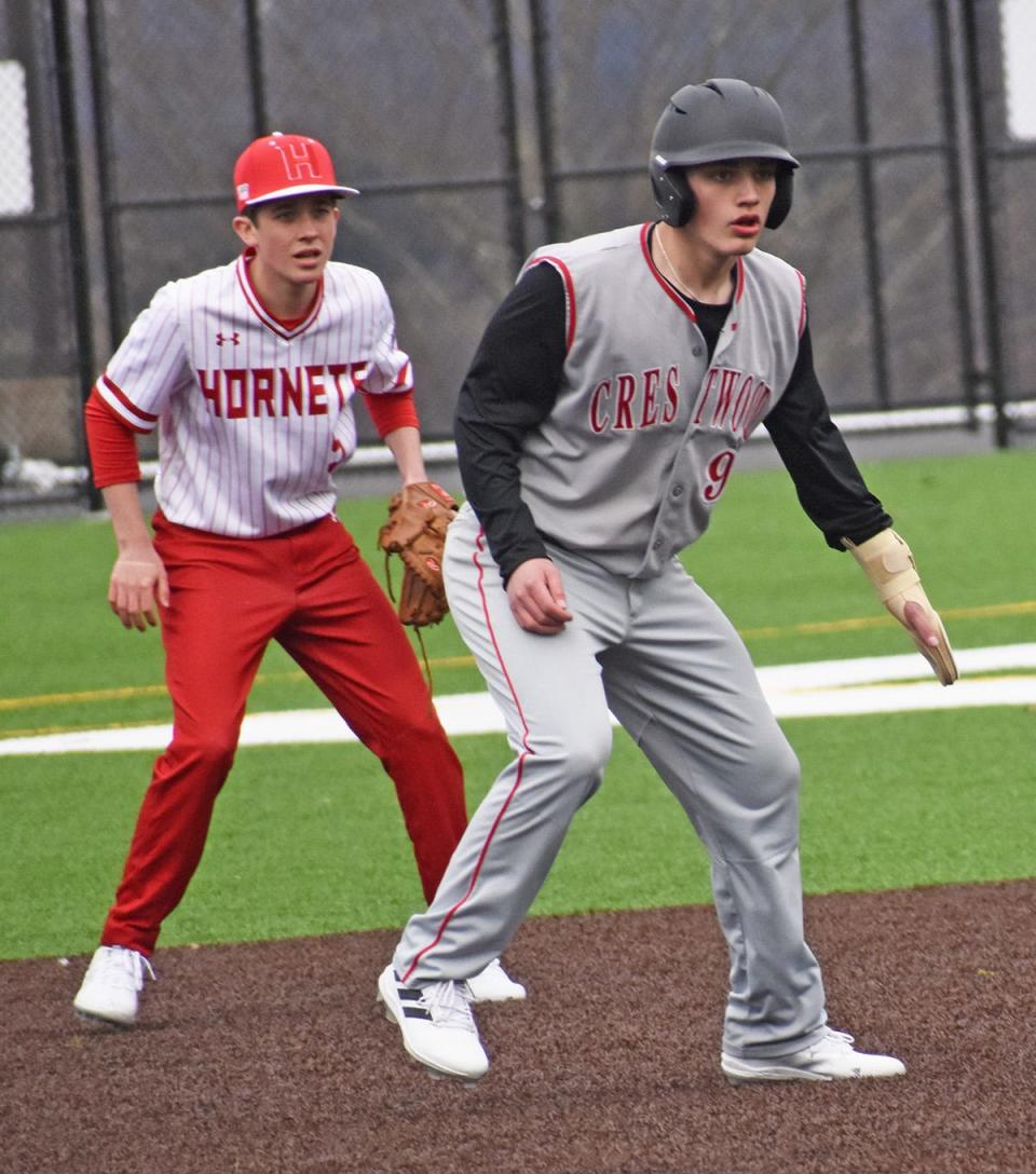 Honessdale shortstop Jack Eisele works to keep a Crestwood baserunner close Tuesday afternoon on the turf at the Daniel J. O'Neill Sports Complex.