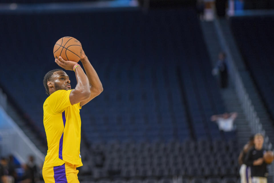 Los Angeles Lakers guard Bronny James warms up before an NBA summer league basketball game against the Sacramento Kings in San Francisco , Saturday, July 6, 2024. (AP Photo/Nic Coury)