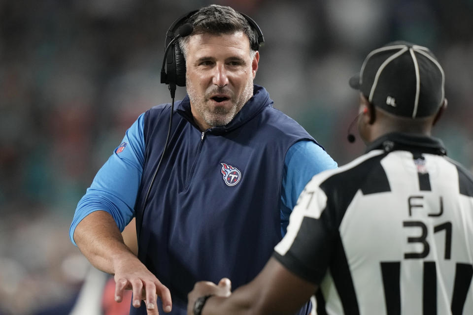 Tennessee Titans head coach Mike Vrabel talks to field judge Mearl Robinson (31) during the second half of an NFL football game against the Miami Dolphins, Monday, Dec. 11, 2023, in Miami. (AP Photo/Lynne Sladky)