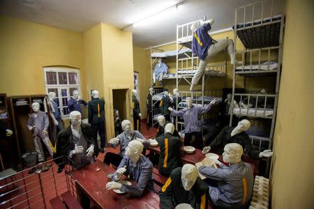 A view of a restored prison cell in an exhibition area in a former prison in Cottbus November 4, 2014. REUTERS/Hannibal