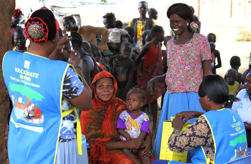 FILE PHOTO: South Sudanese health workers prepare to administer vaccination against measles to children in Juba