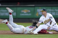 Philadelphia Phillies' Cristian Pache, left, is tagged out at first by Oakland Athletics first baseman Ryan Noda, right, for a double play during the eighth inning of a baseball game in Oakland, Calif., Friday, June 16, 2023. Phillies' Trea Turner hit a line-out to third baseman Jonah Bride on the play. (AP Photo/Godofredo A. Vásquez)