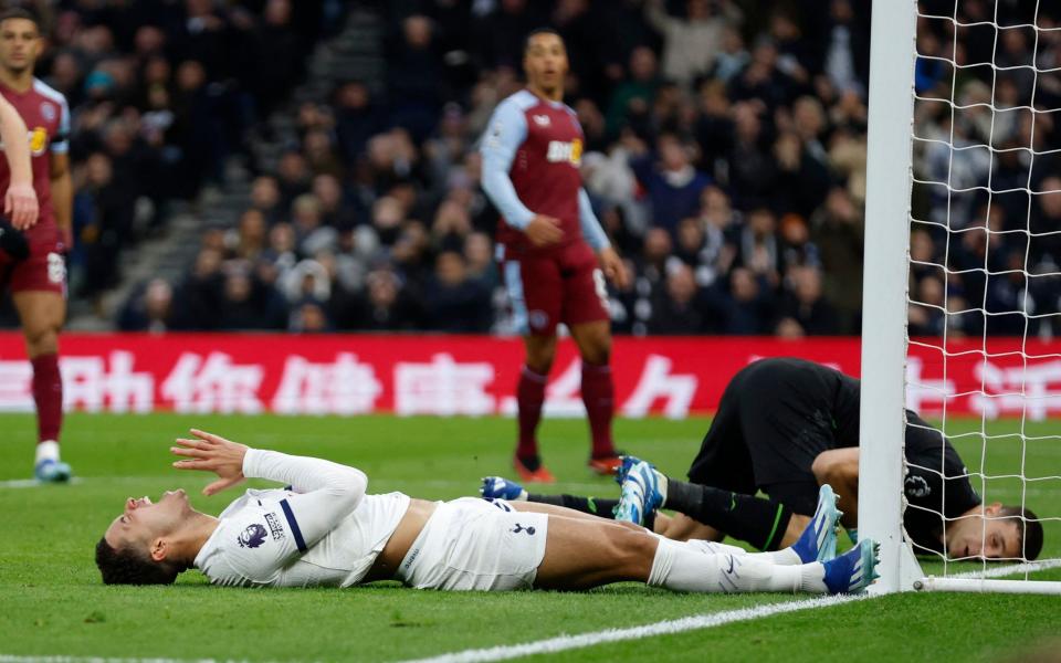 Tottenham Hotspur's Brennan Johnson on the ground in frustration after not reaching a cross