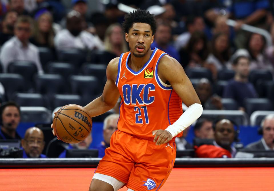 Mar 20, 2022; Orlando, Florida, USA; Oklahoma City Thunder guard Aaron Wiggins (21) drives to the basket against the Orlando Magic during the first quarter at Amway Center. Mandatory Credit: Kim Klement-USA TODAY Sports