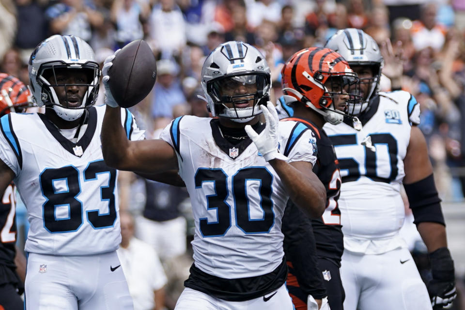 Carolina Panthers running back Chuba Hubbard celebrates after scoring against the Cincinnati Bengals during the first half of an NFL football game, Sunday, Sept. 29, 2024, in Charlotte, N.C. (AP Photo/Erik Verduzco)