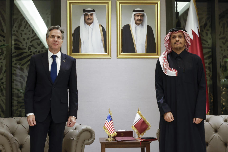 U.S. Secretary of State Antony Blinken, left, meets with Qatar's Prime Minister and Foreign Minister Sheikh Mohammed bin Abdulrahman Al Thani, right, at Lusail Palace in Lusail, Qatar, Sunday, Jan. 7, 2024, during Blinken's week-long trip aimed at calming tensions across the Middle East. (Evelyn Hockstein/Pool photo via AP)