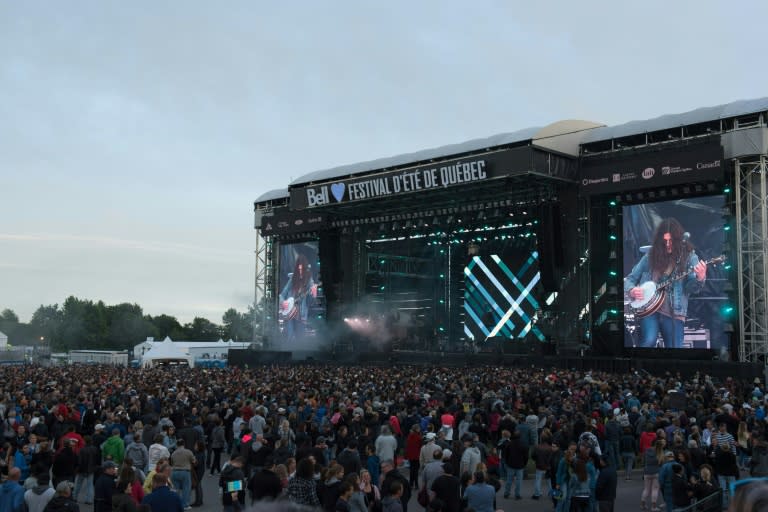 The crowd at Quebec's Festival d'ete de Quebec watching rocker Kurt Vile on the huge stage in the Plains of Abraham park