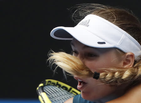 Tennis - Australian Open - Third Round - Melbourne Park, Melbourne, Australia, January 18, 2019. Denmark's Caroline Wozniacki in action during the match against Russia's Maria Sharapova. REUTERS/Aly Song