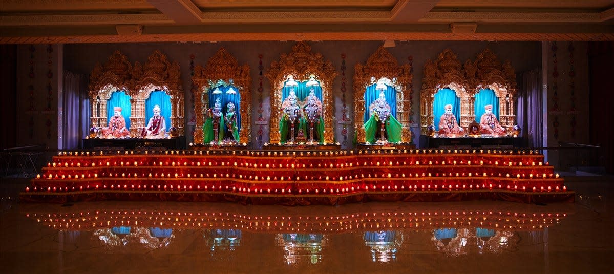 Devotees at the BAPS Shri Swaminarayan Mandir in Edison celebrate Diwali in 2022. Known as the Hindu festival of lights, Diwali is a joyful holiday that originated in India.