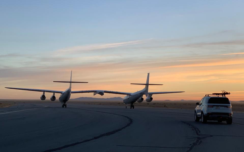 WhiteKnightTwo, the plane that carries Virgin Galactic's SpaceShipTwo to an altitude of 50,000 feet for its rocket launch to 50 miles high, taxis down the runway on a recent morning for a test flight near the company's California facility in Mojave.