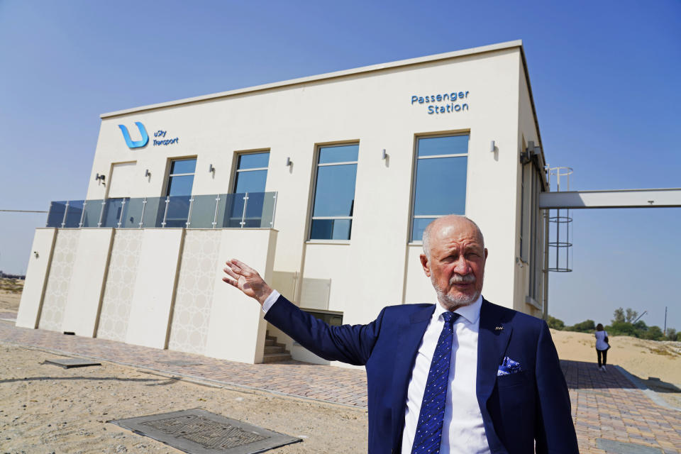 Anatoli Unitsky, the creator of the string rail technology used by the pod-transport firm uSky, speaks to journalists at a testing track in Sharjah, United Arab Emirates, Thursday, Oct. 28, 2021. The futuristic transit solution is being promoted by a Belarusian firm that hopes to secure contracts here in the near future. However, uSky has ties back to a Belarusian investment firm called SkyWay that has seen multiple nations in Europe and elsewhere issue warnings to investors that they "may be involved in a scam." (AP Photo/Jon Gambrell)