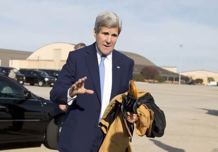 U.S. Secretary of State John Kerry is seen before boarding his plane at Andrews Air Force Base in Maryland, en route to Ottawa, Canada, October 28, 2014. REUTERS/Carolyn Kaster/Pool