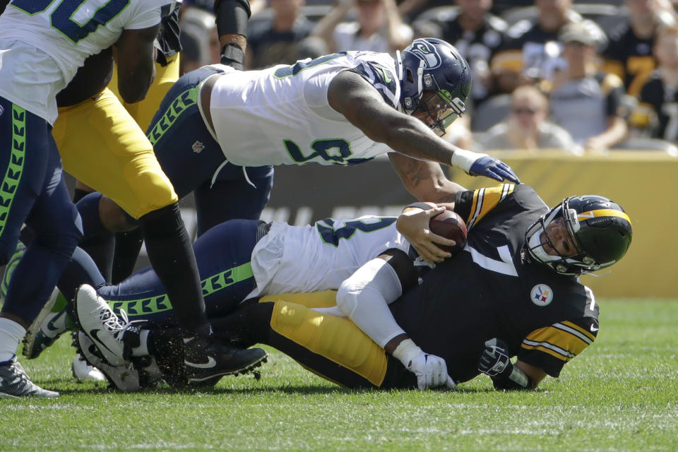 Pittsburgh Steelers quarterback Ben Roethlisberger (7) is sacked by Seattle Seahawks defensive end Rasheem Green (98) and Jadeveon Clowney in the first half of an NFL football game, Sunday, Sept. 15, 2019, in Pittsburgh. (AP Photo/Gene J. Puskar)