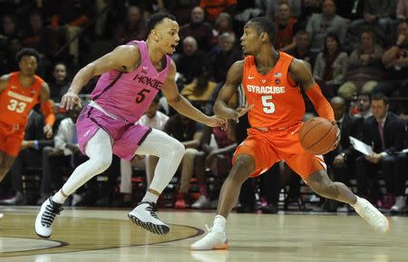 Jan 26, 2019; Blacksburg, VA, USA; Syracuse Orange guard Jalen Carey (right) dribbles against Virginia Tech Hokies guard Justin Robinson (left) in the first half at Cassell Coliseum. Mandatory Credit: Michael Shroyer-USA TODAY Sports