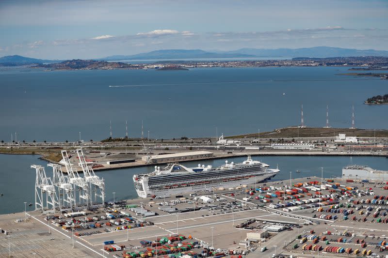 The cruise ship Grand Princess docks at the Port of Oakland as authorities prepare for a passenger debarkation after 21 people on board have tested positive for the COVID-19 coronavirus in Oakland