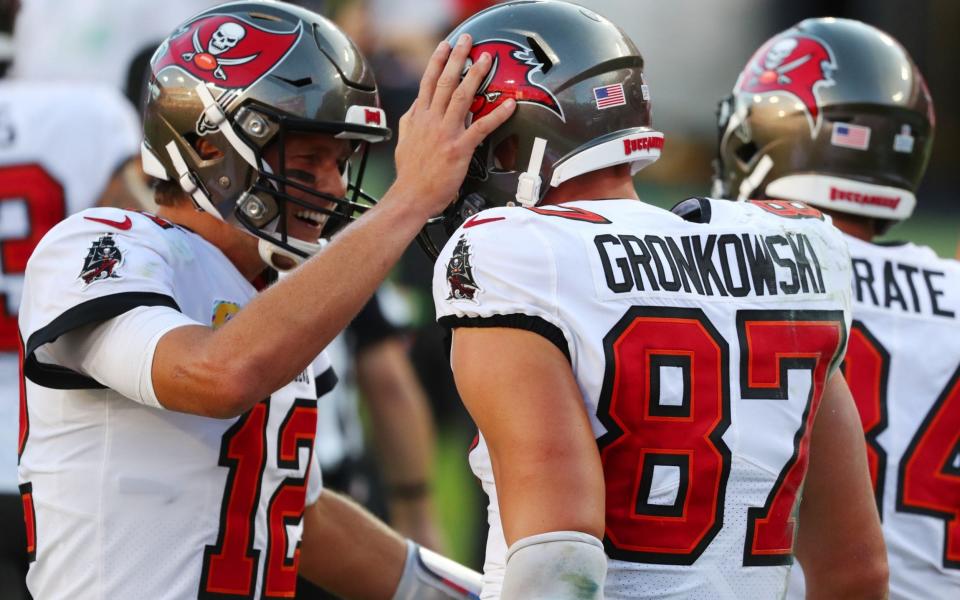 Tampa Bay Buccaneers tight end Rob Gronkowski (87) celebrates with quarterback Tom Brady (12) after scoring a touchdown against the Green Bay Packers during the second quarter of a NFL game at Raymond James Stadium.  - Kim Klement-USA TODAY Sports