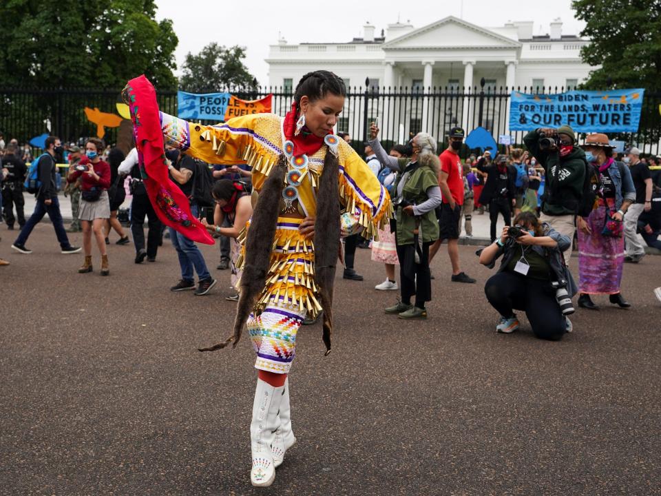 Indigenous activist hold protest in front of the White House demanding climate action