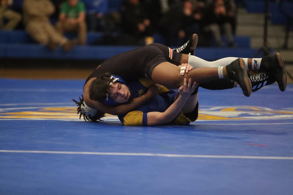 Aberdeen Central's 132 pounder Brock Martin looks for a reversal against Huron's Jeran Sammons in a dual earlier this year. Martin won the Lee Wolf Invitational Tournament last year.