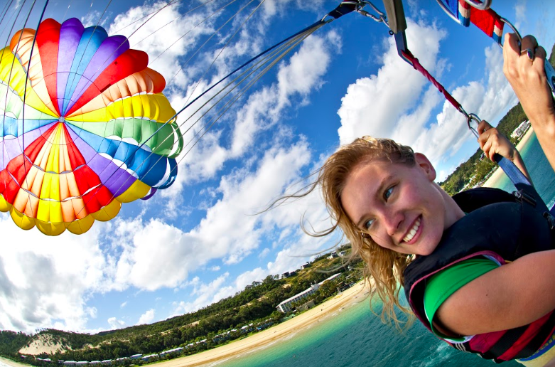 <p>You’ve seen the view from your cruise bedroom window, but how about a look from up above? Parasailing is one of the dare devil activities on offer during the day trip, getting the adrenaline running and a good splash in the water by the end of it. They also do sand dune sliding for those who prefer to be more grounded.<br>Photo: Supplied </p>