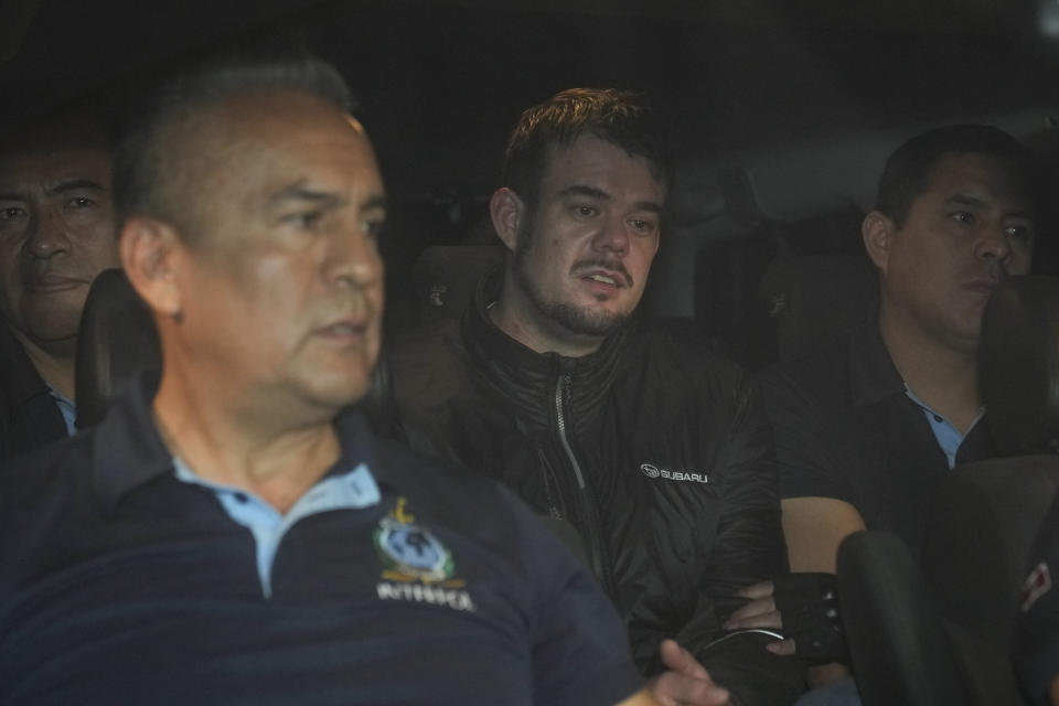 Dutch citizen Joran van der Sloot, center, is driven in a police vehicle from the Ancon I maximum-security prison, outskirts of Lima, Peru, Thursday, June 8, 2023. The main suspect in the unsolved 2005 disappearance of American student Natalee Holloway on the Caribbean island of Aruba is expected to be extradited Thursday from Peru to the United States. (AP Photo/Martin Mejia)