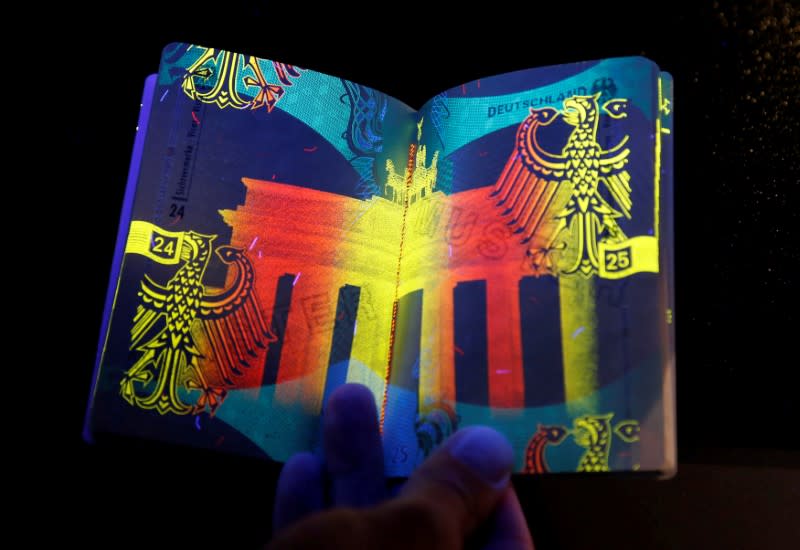 FILE PHOTO: The new German electronic passport is pictured under an ultraviolet light during its presentation to the media in Berlin