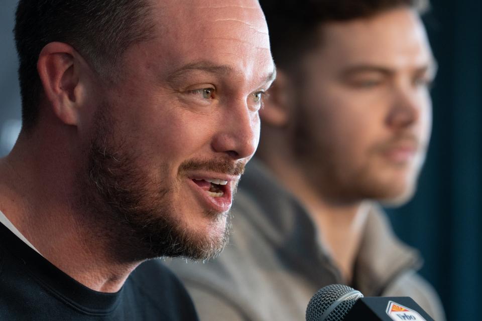 Oregon head coach Dan Lanning (left) speaks during a Vrbo Fiesta Bowl news conference on Dec. 26, 2023, at the Lincoln J. Ragsdale Executive Terminal at Sky Harbor International Airport in Phoenix.