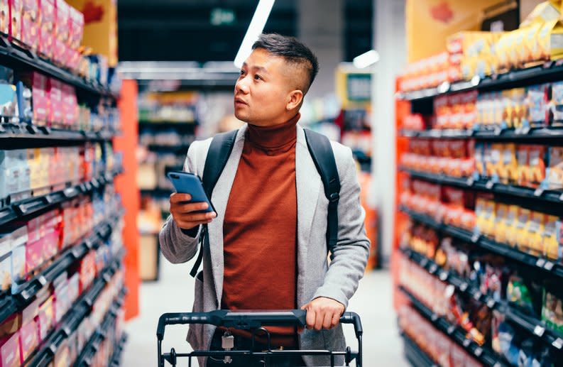 Young person shopping grocery aisle