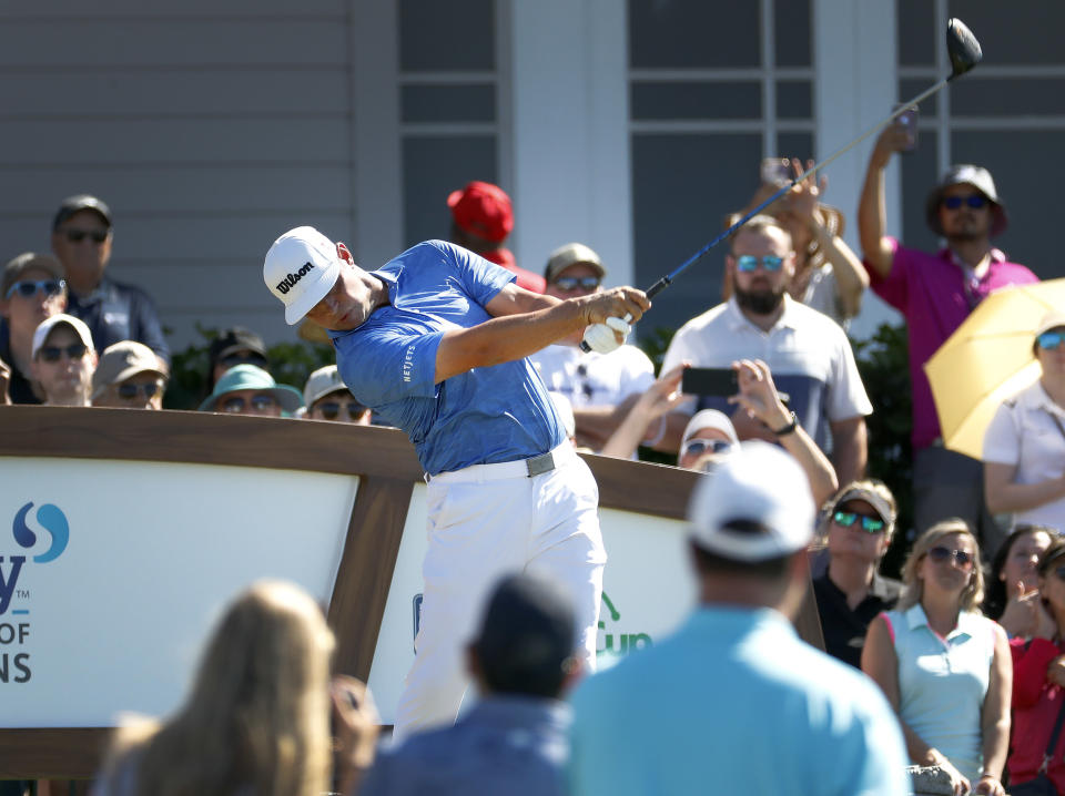 Gary Woodland plays his shot from the first tee during the final round of the Tournament of Champions golf event, Sunday, Jan. 6, 2019, at Kapalua Plantation Course in Kapalua, Hawaii. (AP Photo/Matt York)