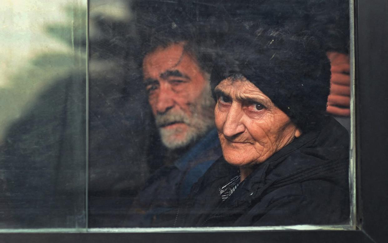 Residents sit inside a bus in central Stepanakert before leaving Nagorno-Karabakh, a region inhabited by ethnic Armenians, September 25, 2023.