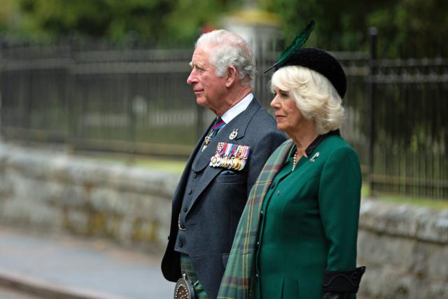 Britain's Prince Charles, Prince of Wales (L) and Britain's Camilla, Duchess of Cornwall (R) observe a 2 minute silence to mark the 75th anniversary of VE Day (Victory in Europe Day), the end of the Second World War in Europe at the Balmoral War Memorial in central Scotland on May 8, 2020. (Photo by Amy Muir / POOL / AFP) (Photo by AMY MUIR/POOL/AFP via Getty Images)