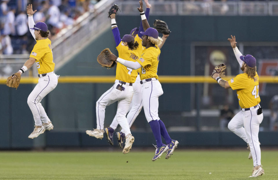 LSU's Ben Nippolt, Paxton Kling, Jordan Thompson, Tre' Morgan and Tommy White, from left, celebrate the team's 5-2 victory against Wake Forest in a baseball game at the NCAA College World Series in Omaha, Neb., Wednesday, June 21, 2023. (AP Photo/Rebecca S. Gratz)