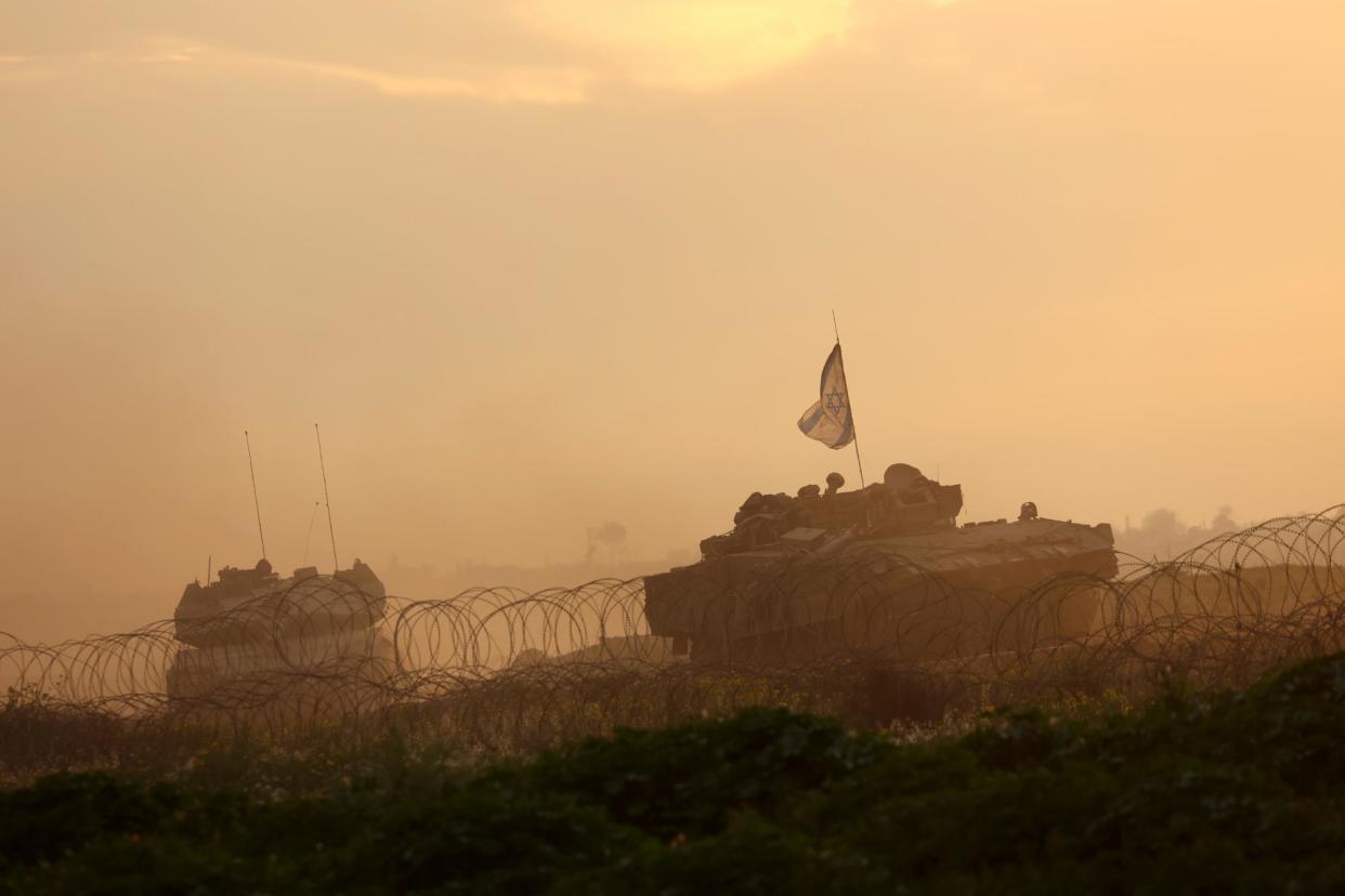 <span>Israeli tanks near the border with Gaza Strip on 12 February.</span><span>Photograph: Xinhua/REX/Shutterstock</span>