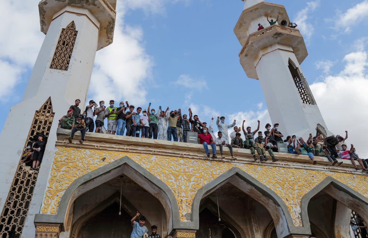 Libyans protest outside the mosque one week after the deadly floods in Derna (Reuters)