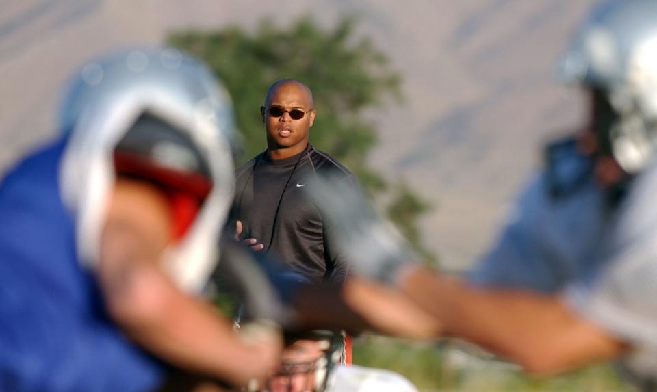 Former BYU running back Kalin Hall, the father of Jaren Hall, works with the Payson High football team during a practice at the high school Friday, August 16, 2002. | Jason Olson, Deseret News