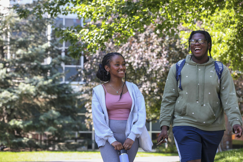 Bridge to Calculus summer program participants Wintana Tewolde, left, and Peter St. Louis-Severe walk through the campus of Northeastern University in Boston on Tuesday, Aug. 1, 2023. (AP Photo/Reba Saldanha)