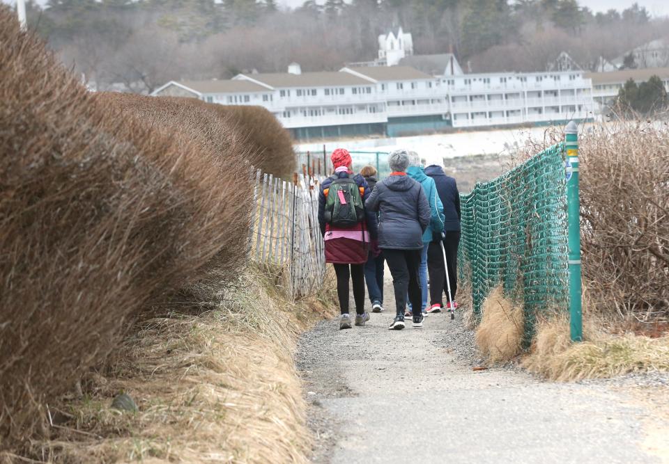 A group of friends enjoy a walk along Marginal Way in Ogunquit. The scenic path reopened to the public after being closed due to storm damage.