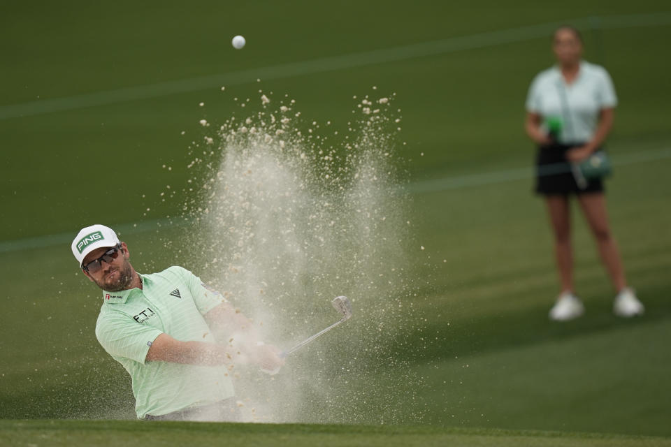 Corey Conners, of Canada, blasts out of a bunker on the second hole during the third round of the Masters golf tournament on Saturday, April 10, 2021, in Augusta, Ga. (AP Photo/David J. Phillip)