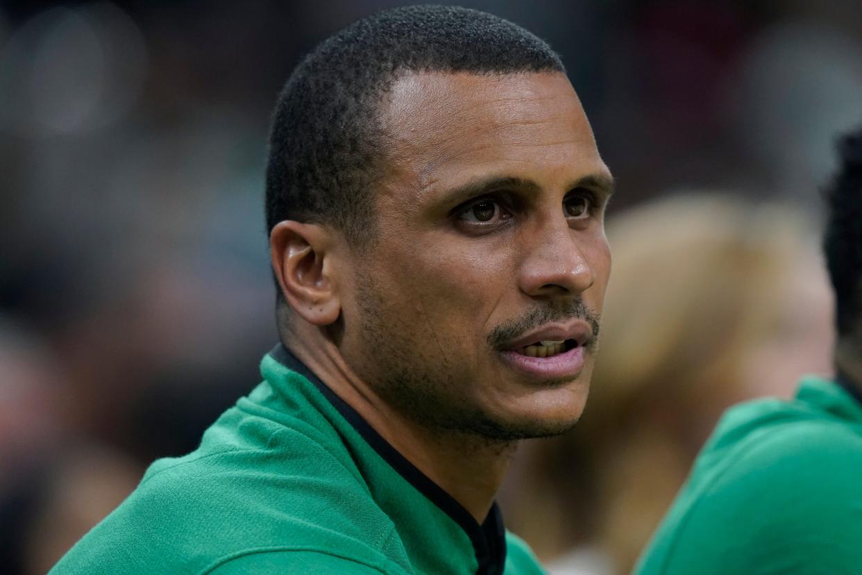 Boston Celtics interim head coach Joe Mazzulla sits on the bench in the first half of an NBA basketball game against the Washington Wizards, Sunday, Oct. 30, 2022, in Boston. (AP Photo/Steven Senne)