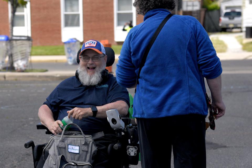 Stanley Soden talks with Judyth Brown, executive director of MOCEANS Center for Independent Living, during MOCEANS’s resource fair on Saturday, May 6, 2023 in Long Branch, New Jersey. Soden, a disability rights activist, works for MOCEANS. 