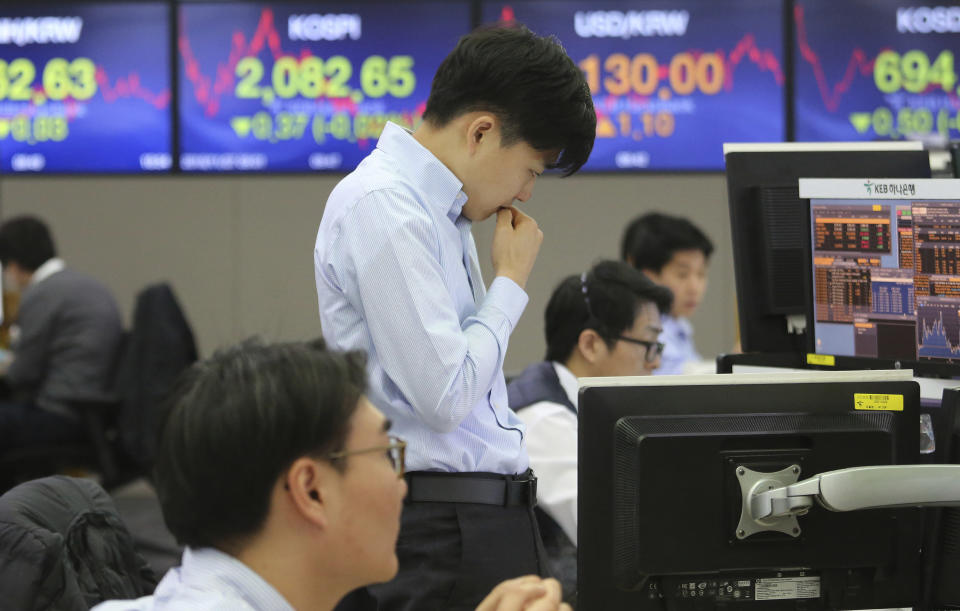 A currency trader watches monitors at the foreign exchange dealing room of the KEB Hana Bank headquarters in Seoul, South Korea, Tuesday, Nov. 27, 2018. Asian markets clocked more gains Tuesday ahead of a meeting between the U.S. and China at the Group of 20 summit this week, despite President Donald Trump's comments that it's "highly unlikely" he'll hold off on raising tariffs as Beijing requested. (AP Photo/Ahn Young-joon)