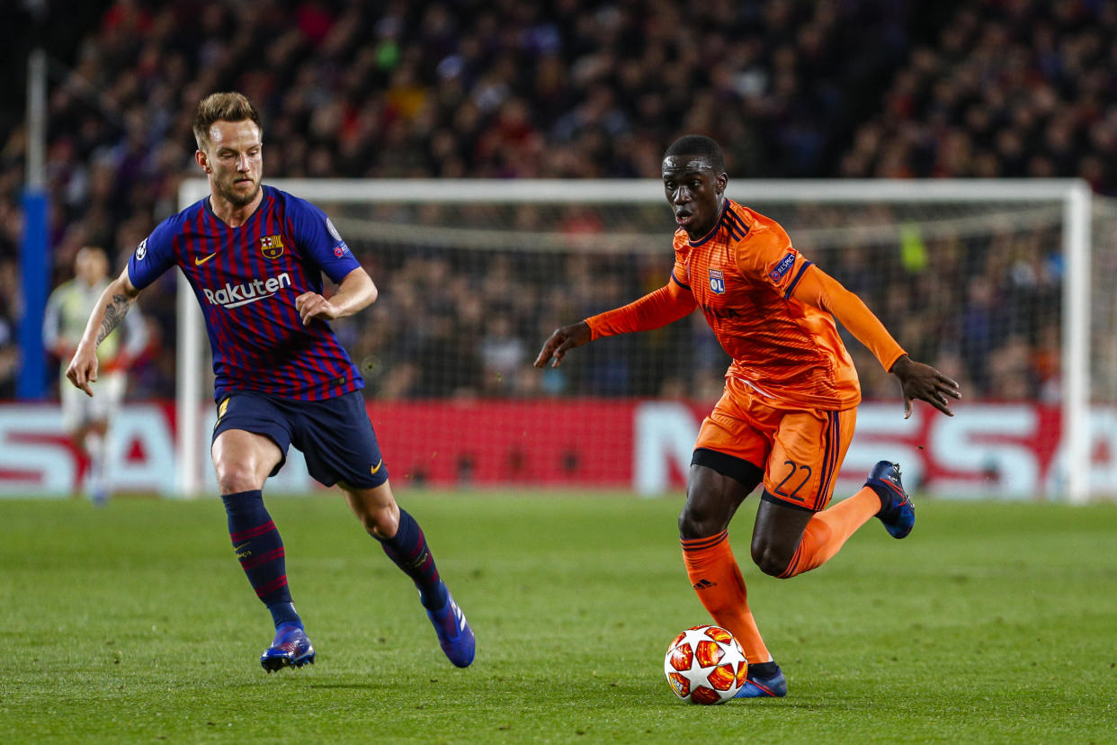 Olympique Lyonnais defender Ferland Mendy (22) and FC Barcelona midfielder Ivan Rakitic (4) during the UEFA Champions League match between FC Barcelona and Olympique Lyonnais at Camp Nou Stadium on March 13, 2019 in Barcelona, Spain. (Credit: Mikel Trigueros / Urbanandsport / NurPhoto via Getty Images) -- (Photo by Urbanandsport/NurPhoto via Getty Images)