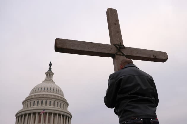 Supporters of U.S. President Donald Trump pray outside the U.S. Capitol January 06, 2021 in Washington, DC. - Credit: Win McNamee/Getty Images