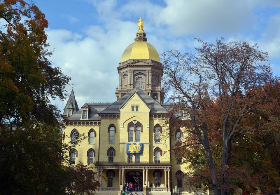 The golden dome of the main administration building shines on the Notre Dame campus in South Bend, Indiana.