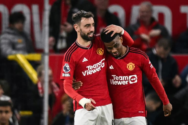 <a class="link " href="https://sports.yahoo.com/soccer/teams/man-utd/" data-i13n="sec:content-canvas;subsec:anchor_text;elm:context_link" data-ylk="slk:Manchester United;sec:content-canvas;subsec:anchor_text;elm:context_link;itc:0">Manchester United</a>'s <a class="link " href="https://sports.yahoo.com/soccer/players/1925829/" data-i13n="sec:content-canvas;subsec:anchor_text;elm:context_link" data-ylk="slk:Amad Diallo;sec:content-canvas;subsec:anchor_text;elm:context_link;itc:0">Amad Diallo</a> (R) celebrates with <a class="link " href="https://sports.yahoo.com/soccer/players/380323/" data-i13n="sec:content-canvas;subsec:anchor_text;elm:context_link" data-ylk="slk:Bruno Fernandes;sec:content-canvas;subsec:anchor_text;elm:context_link;itc:0">Bruno Fernandes</a> (Oli SCARFF)